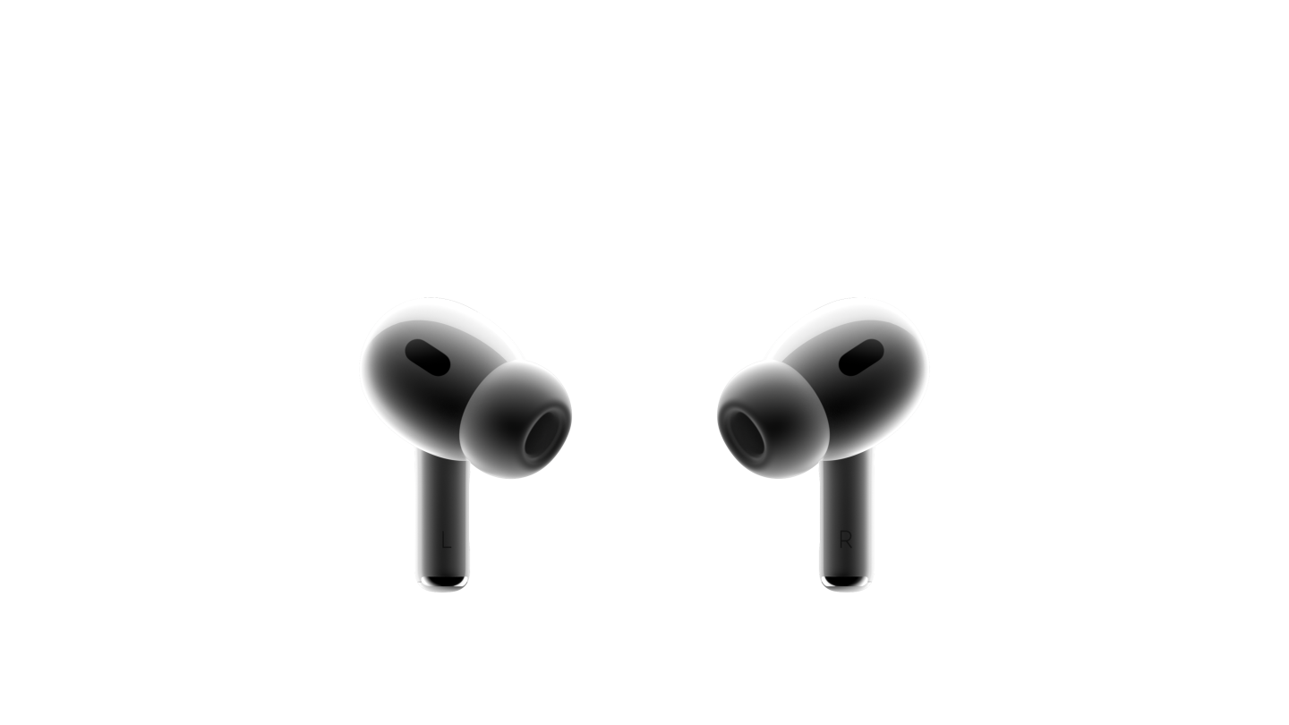 Two white AirPods Pro earbuds facing each other. Silicone ear tips attached to compact earbud with black mesh on each.