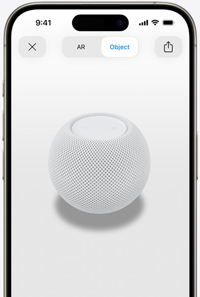 White HomePod on the screen of an iPhone in AR view.
