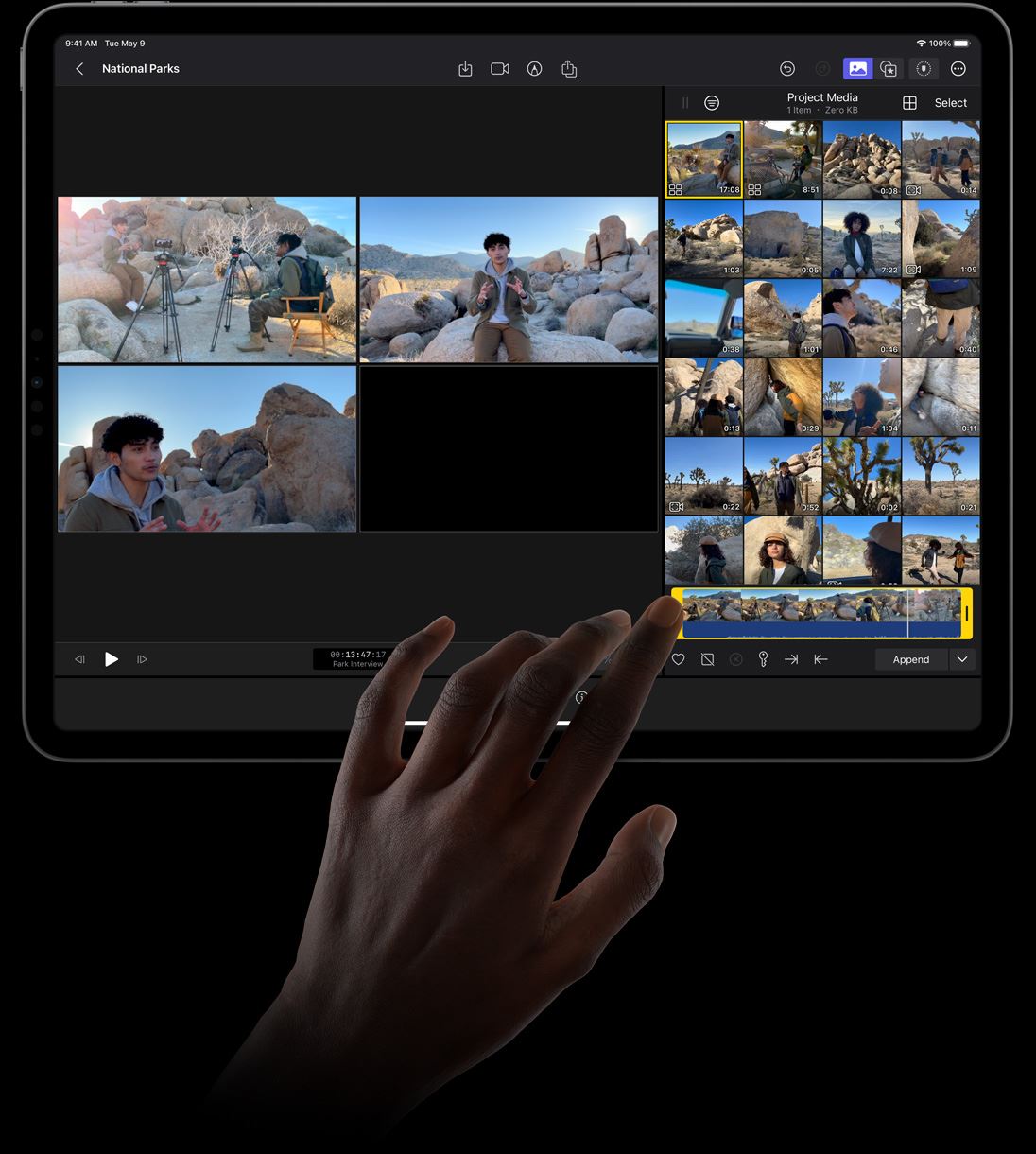 Hand tapping display of iPad Pro to select footage from angle editor in Final Cut Pro for iPad.